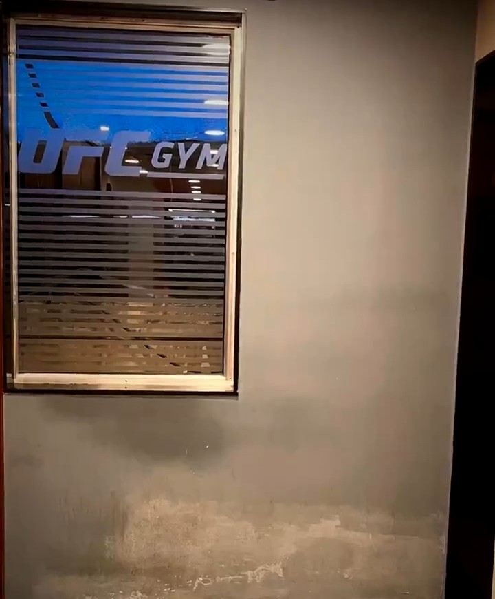 UFC Gym wall before installation - bare cement wall in Mumbai
