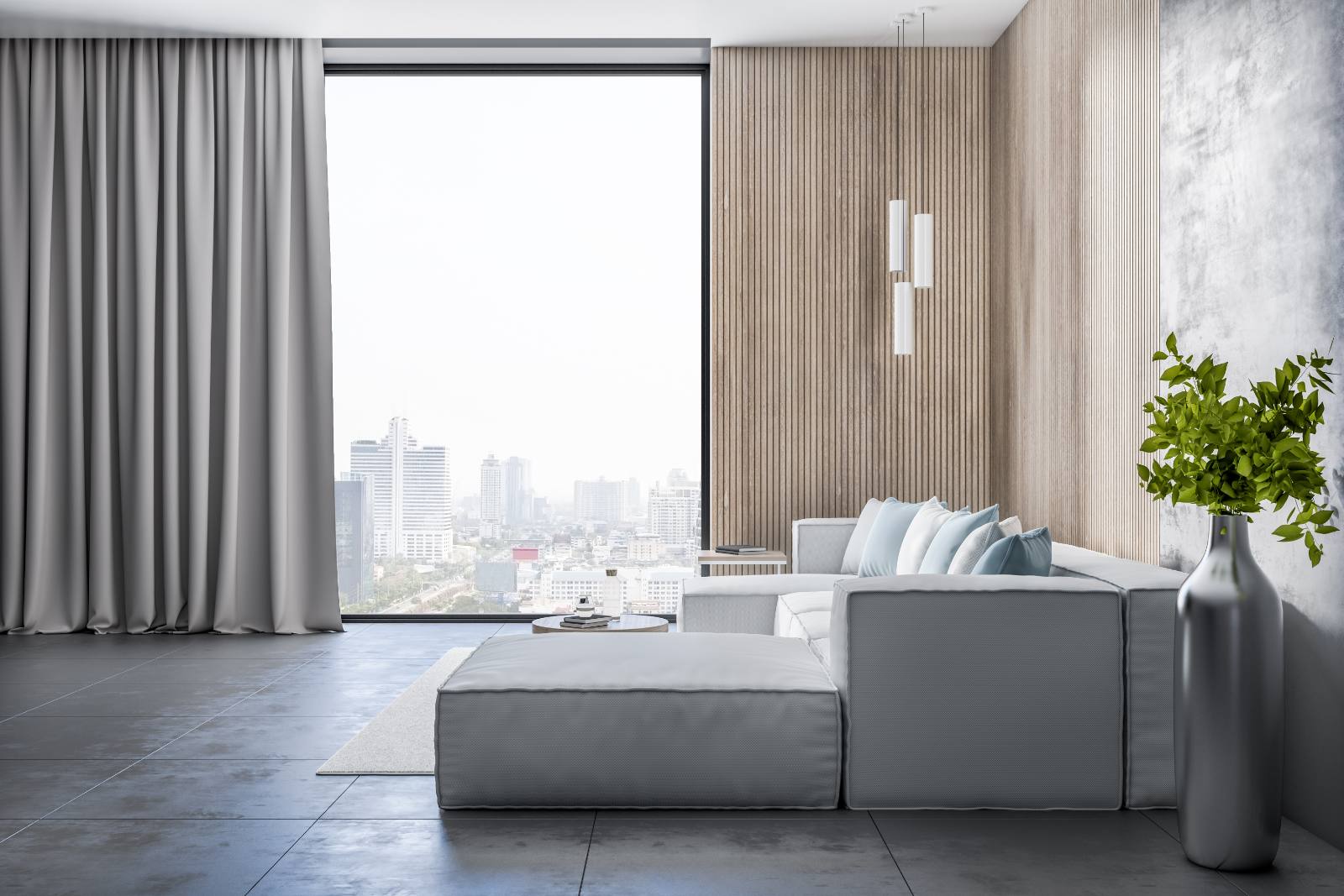 Living room with a wood panelled wall, grey sofa and large window