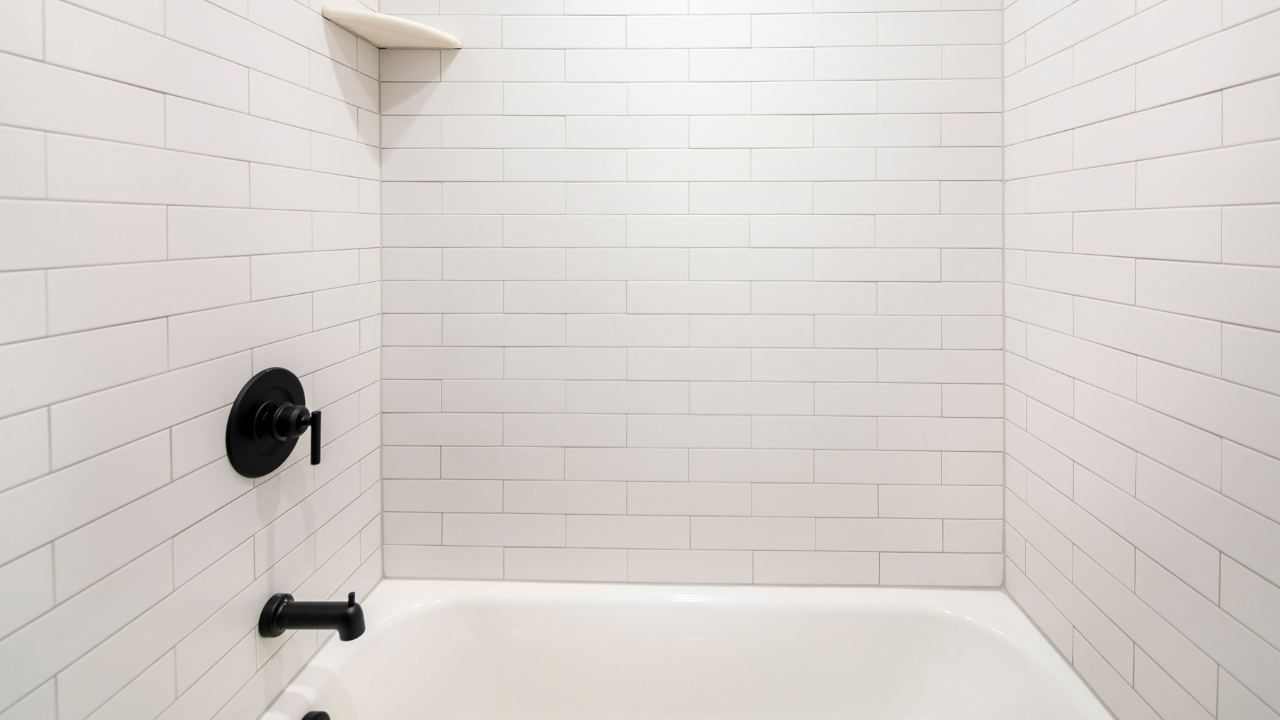 Tiled bath alcove with sound, flat tiles that panels can be fixed over