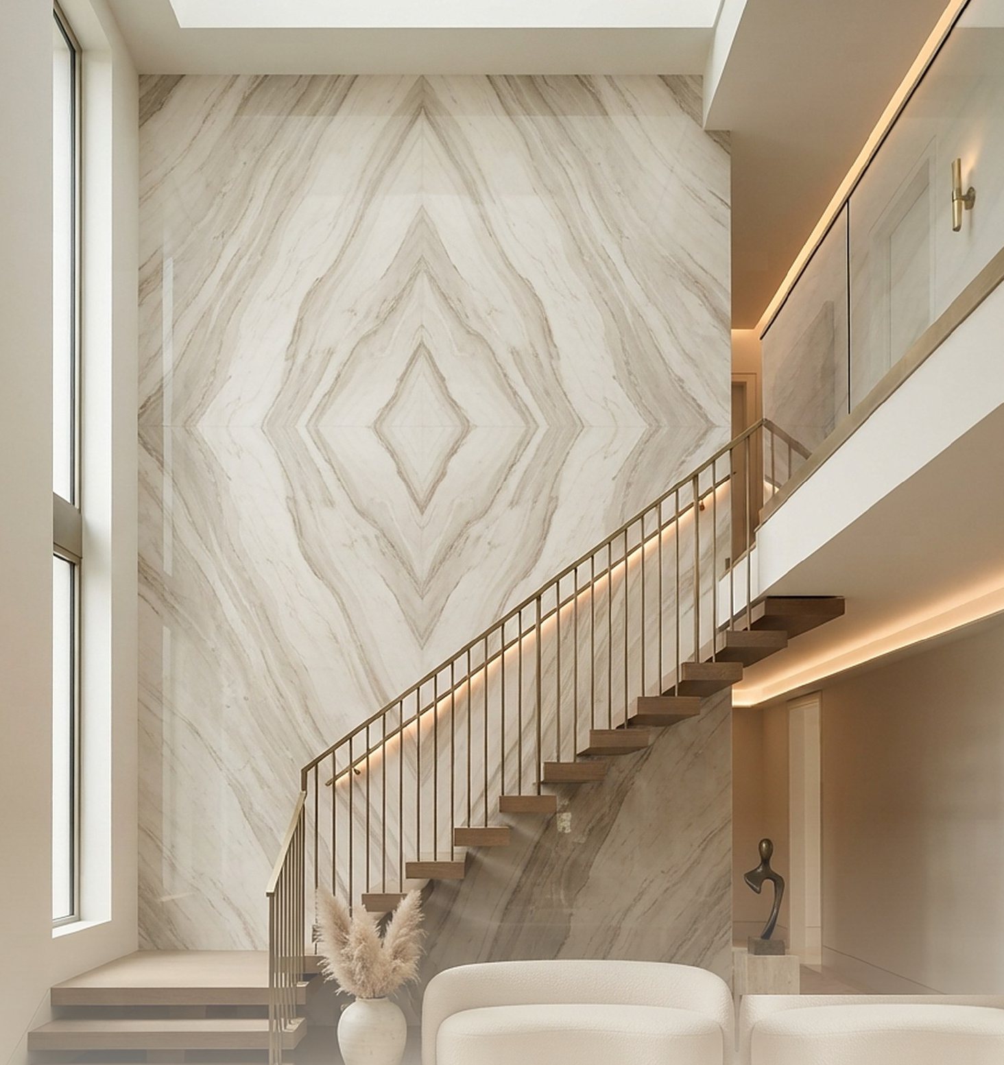 Bookmatch SPC marble wall cladding on a double-height staircase wall