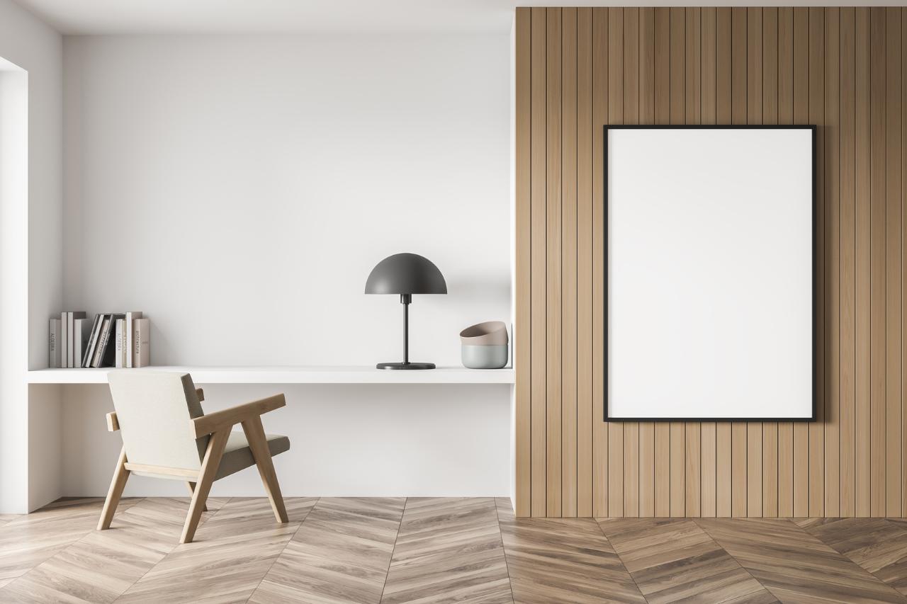 Bedroom study corner with a vertical wood slat wall panel behind a framed poster