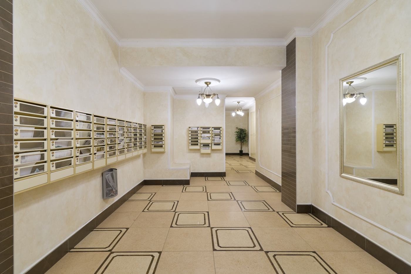 Residential common corridor with letter boxes and tiled floor