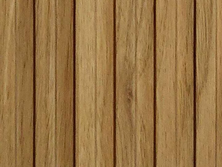 Real sample of VENTIQUE WPC fluted louver in a natural oak finish with chamfered battens