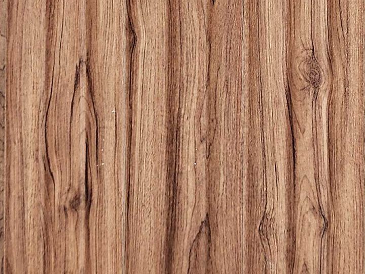 Real sample of LUXORA charcoal-PS louver in a warm walnut finish with fine wave flutes