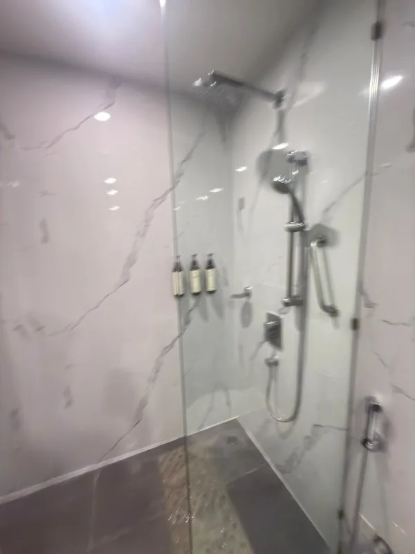 Maestà UV marble sheets lining a five-star hotel shower in Pune, a real Urbane Decor installation