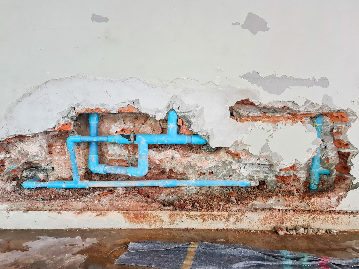 Bathroom wall opened up to repair leaking concealed water pipes
